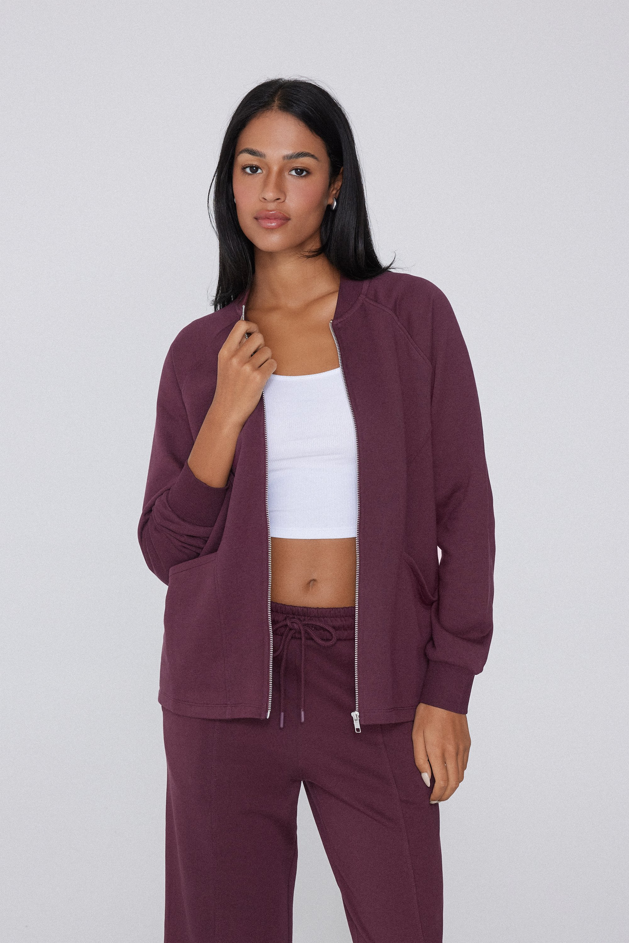 Lange asymmetrische Sweatjacke mit Reißverschluss und Taschen